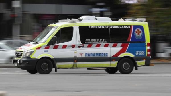 An ambulance vehicle driving with a blurred background