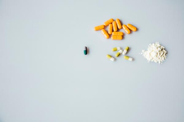 A collection of legal pills and flour, meant to represent illicit drugs. Photo by Markus Spiske on Unsplash