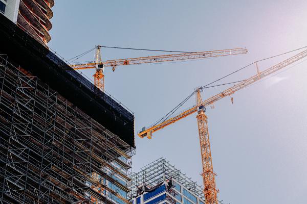 Cranes suspended above a construction site