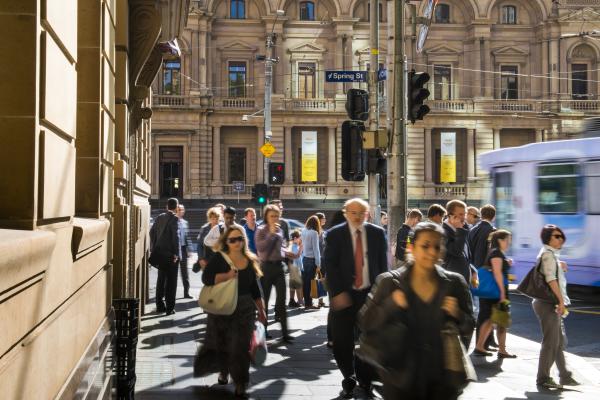 Peak hour in melbourne as pedestrians rush to work
