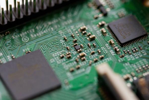 An image of a motherboard, showing the circuits present. Photo by Chris Ried on Unsplash